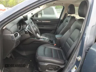 2024 Mazda CX-5 S Carbon Edition z VIN JM3KFBCL5R0493025, wystawiony jako Copart lot #52596785 z przebiegiem 12 360 mil mil oraz Szkoda całkowita • Salvage title. Historia ofert i sprzedaży dostępna na DreamBid. Obrazek 7.