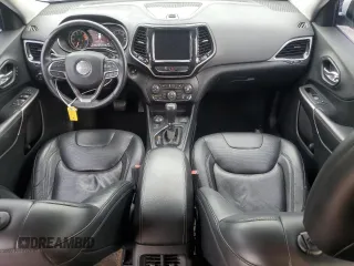 2019 Jeep Cherokee Limited with VIN 1C4PJMDX2KD409798, listed as a Copart auction lot 56913685 with 59,299 mi miles and Salvage title. Bid and sale history available at DreamBid. Image 8.
