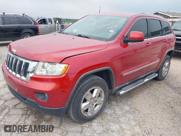 2011 Jeep Grand Cherokee Laredo with VIN 1J4RS4GG1BC673290, listed as a IAAI auction lot 42042557 with 147,590 mi miles and . Bid and sale history available at DreamBid. Image 2.