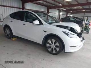2023 Tesla Model Y Long Range z VIN 7SAYGDEE2PF834036, wystawiony jako IAAI lot #41933120 z przebiegiem 27 872 mil mil oraz . Historia ofert i sprzedaży dostępna na DreamBid. Obrazek 1.