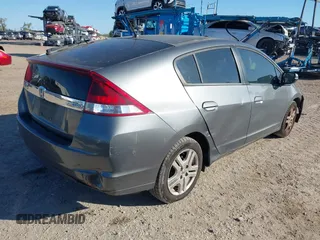 2012 Honda Insight LX with VIN JHMZE2H51CS003694, listed as a IAAI auction lot 41781384 with 154,685 mi miles and . Bid and sale history available at DreamBid. Image 4.