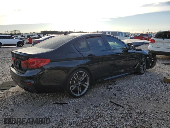 2020 BMW 5 Series M550i xDrive with VIN WBAJS7C01LCD23365, listed as a Copart auction lot 88302885 with Not provided miles and Salvage title. Bid and sale history available at DreamBid. Image 3.