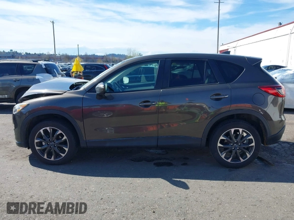 2016 Mazda CX-5 Grand Touring with VIN JM3KE2DYXG0773663, listed as a IAAI auction lot 41896367 with 86,571 mi miles and . Bid and sale history available at DreamBid. Image 15.