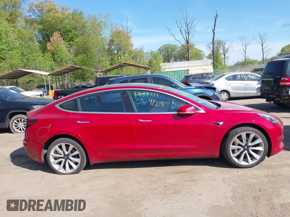 2018 Tesla Model 3 Long Range Battery z VIN 5YJ3E1EA3JF047287, wystawiony jako IAAI lot #42099771 z przebiegiem 120 470 mil mil oraz . Historia ofert i sprzedaży dostępna na DreamBid. Obrazek 12.