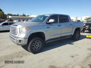 2014 Toyota Tundra Platinum with VIN 5TFAW5F16EX399219, listed as a Copart auction lot 61434225 with 68,302 mi miles and Salvage title. Bid and sale history available at DreamBid. Image 1.