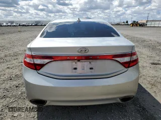 2013 Hyundai Azera z VIN KMHFG4JG7DA218926, wystawiony jako Copart lot #57419495 z przebiegiem 90 968 mil mil oraz Szkoda całkowita • Salvage title. Historia ofert i sprzedaży dostępna na DreamBid. Obrazek 6.