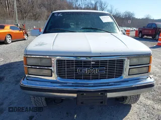 1999 GMC Yukon with VIN 1GKEK13R8XJ763098, listed as a IAAI auction lot 41753745 with 209,451 mi miles. Bid and sale history available at carsss.com. Image 13.