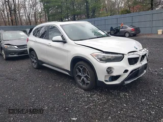 2018 BMW X1 xDrive28i with VIN WBXHT3C36J5L32162, listed as a IAAI auction lot 41802315 with 80,422 mi miles. Bid and sale history available at carsss.com. Image 1.