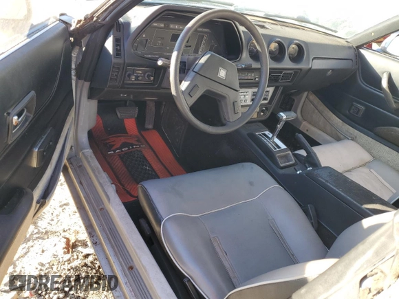 1983 Datsun 280ZX z VIN JN1HZ04S6DX571982, wystawiony jako Copart lot #86317294 z przebiegiem Nie podano mil oraz Tytuł czysty. Historia ofert i sprzedaży dostępna na DreamBid. Obrazek 8.