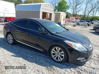 2012 Hyundai Azera with VIN KMHFG4JG1CA185369, listed as a IAAI auction lot 42031314 with 143,461 mi miles. Bid and sale history available at carsss.com. Image 1.