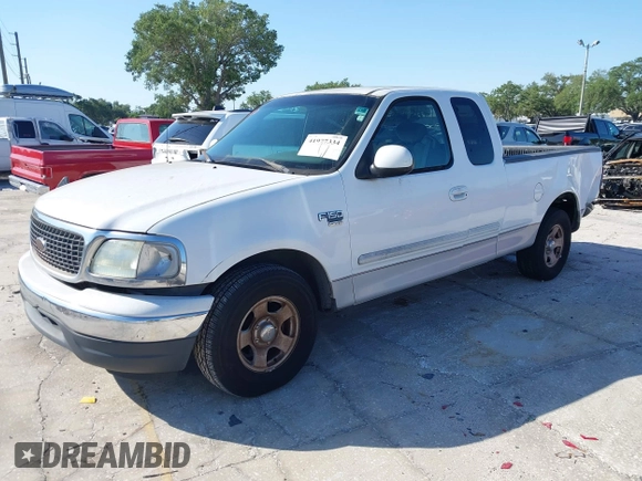 2002 Ford F-150 XL with VIN 1FTRX17WX2NA92467, listed as a IAAI auction lot 41977334 with 176,902 mi miles. Bid and sale history available at carsss.com. Image 2.