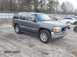 2002 GMC Yukon SLT with VIN 1GKEC13ZX2J217778, listed as a IAAI auction lot 41469912 with 293,497 mi miles. Bid and sale history available at carsss.com. Image 1.