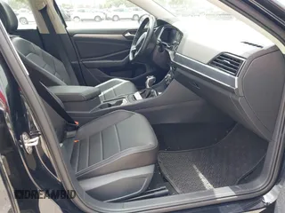 2023 Volkswagen Jetta SE with VIN 3VW7M7BU3PM037141, listed as a IAAI auction lot 42446046 with 21,149 mi miles and . Bid and sale history available at DreamBid. Image 5.