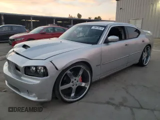 2006 Dodge Charger SRT-8 with VIN 2B3KA73W26H279925, listed as a Copart auction lot 78479574 with 127,443 mi miles and Salvage Title. Bid and sale history available at DreamBid. Image 1.