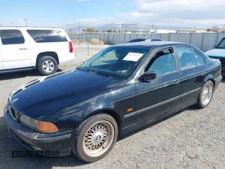 2000 BMW 5 Series 528iA with VIN WBADM6344YGU10257, listed as a IAAI auction lot 41773733 with 231,028 mi miles. Bid and sale history available at carsss.com. Image 2.