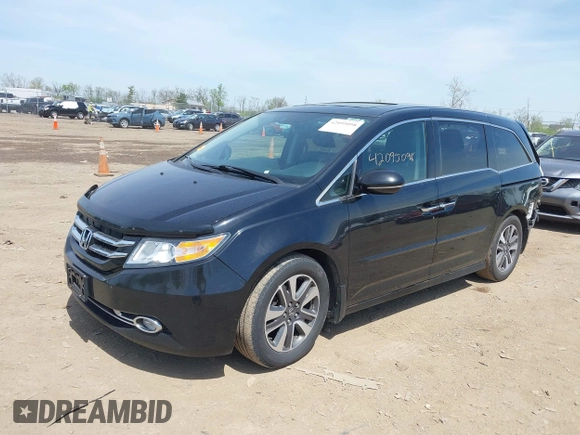 2014 Honda Odyssey Touring with VIN 5FNRL5H94EB079518, listed as a IAAI auction lot 42095098 with 141,019 mi miles and . Bid and sale history available at DreamBid. Image 18.