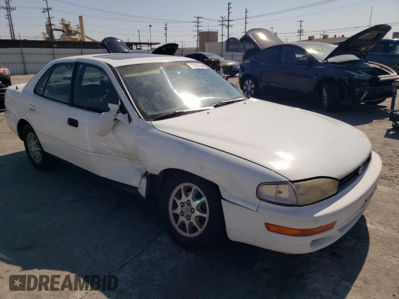 1992 Toyota Camry LE with VIN 4T1SK12E0NU077223, listed as a Copart auction lot 71787194 with 239,027 mi miles and Salvage Title. Bid and sale history available at carsss.com. Image 4.