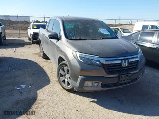 2020 Honda Ridgeline RTL-E with VIN 5FPYK3F72LB011694, listed as a IAAI auction lot 41628184 with 76,011 mi miles. Bid and sale history available at carsss.com. Image 1.