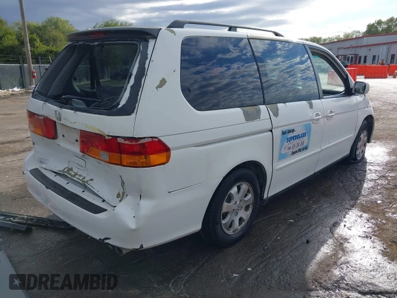 2004 Honda Odyssey EX-L with VIN 5FNRL18074B109717, listed as a IAAI auction lot 37731273 with 314,449 mi miles and . Bid and sale history available at DreamBid. Image 4.