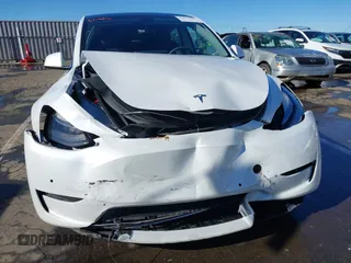 2022 Tesla Model Y Long Range with VIN 7SAYGDEE1NF402745, listed as a IAAI auction lot 41493850 with 11,222 mi miles and . Bid and sale history available at DreamBid. Image 6.