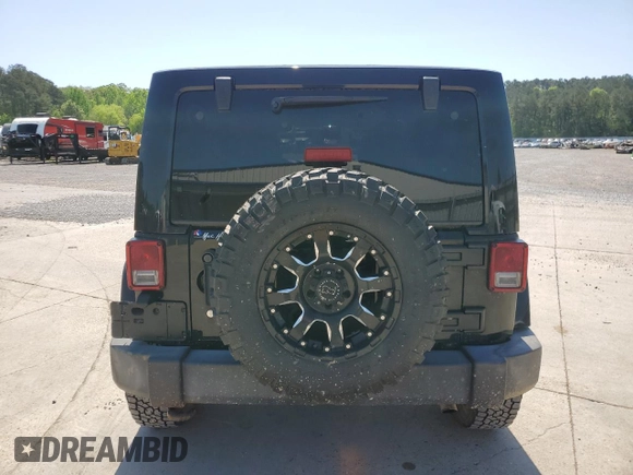 2016 Jeep Wrangler Unlimited Rubicon with VIN 1C4BJWFG5GL290757, listed as a Copart auction lot 52099225 with 102,424 mi miles and Salvage title. Bid and sale history available at DreamBid. Image 6.