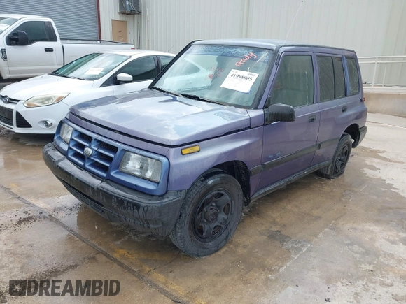 1996 Geo Tracker z VIN 2CNBE1361T6901708, wystawiony jako IAAI lot #41998005 z przebiegiem 223 266 mil mil oraz . Historia ofert i sprzedaży dostępna na DreamBid. Obrazek 2.