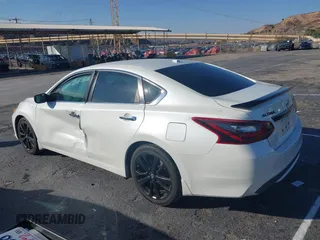 2018 Nissan Altima S with VIN 1N4AL3AP5JC294610, listed as a IAAI auction lot 41436696 with 124,835 mi miles and . Bid and sale history available at DreamBid. Image 3.