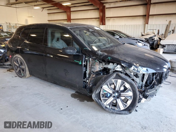 2023 BMW iX xDrive50 with VIN WB523CF08PCM77367, listed as a Copart auction lot 43043695 with 17,213 mi miles and Salvage Title. Bid and sale history available at carsss.com. Image 4.