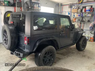 2017 Jeep Wrangler Willys Wheeler with VIN 1C4AJWAGXHL602088, listed as a Copart auction lot 45524745 with 101,847 mi miles and Clean Title. Bid and sale history available at DreamBid. Image 4.