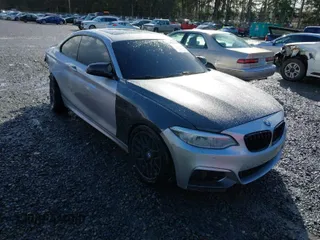 2015 BMW 2 Series 228i with VIN WBA1F5C55FV343662, listed as a IAAI auction lot 41729309 with 90,770 mi miles. Bid and sale history available at carsss.com. Image 1.