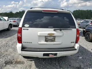 2011 Chevrolet Tahoe LS with VIN 1GNSCAE08BR394917, listed as a Copart auction lot 60470395 with 143,824 mi miles and Salvage title. Bid and sale history available at DreamBid. Image 6.