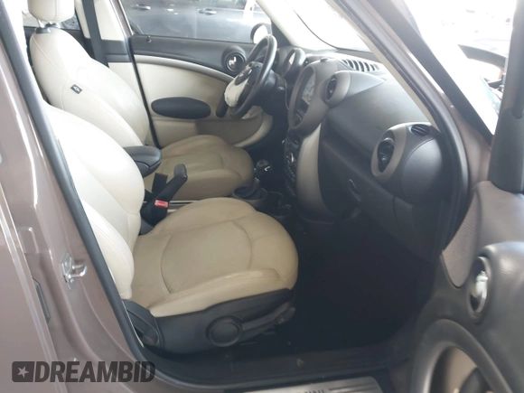 2012 MINI Countryman with VIN WMWZB3C51CWM04563, listed as a IAAI auction lot 42564564 with 95,760 mi miles and . Bid and sale history available at DreamBid. Image 5.