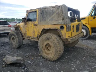 2009 Jeep Wrangler X with VIN 1J4FA24119L754391, listed as a Copart auction lot 56067805 with 118,117 mi miles and Salvage title. Bid and sale history available at DreamBid. Image 2.