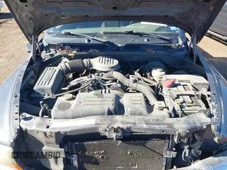 2003 Dodge Dakota SLT with VIN 1D7HL48X03S174569, listed as a IAAI auction lot 41159169 with 156,551 mi miles. Bid and sale history available at carsss.com. Image 10.
