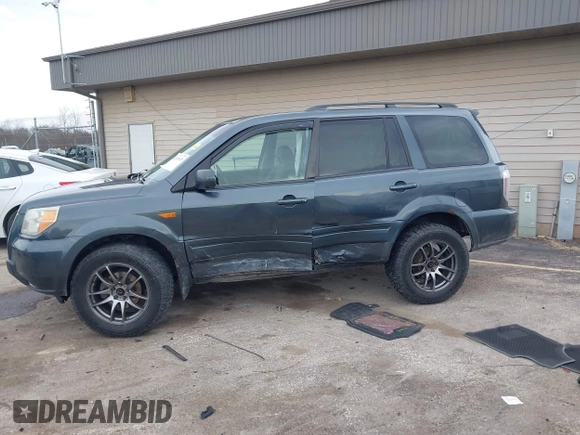 2006 Honda Pilot EX with VIN 5FNYF18426B014815, listed as a IAAI auction lot 42109149 with 284,163 mi miles and . Bid and sale history available at DreamBid. Image 14.