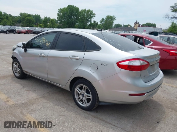 2018 Ford Fiesta SE z VIN 3FADP4BJ6JM106855, wystawiony jako IAAI lot #42491262 z przebiegiem 166 397 mil mil oraz . Historia ofert i sprzedaży dostępna na DreamBid. Obrazek 3.