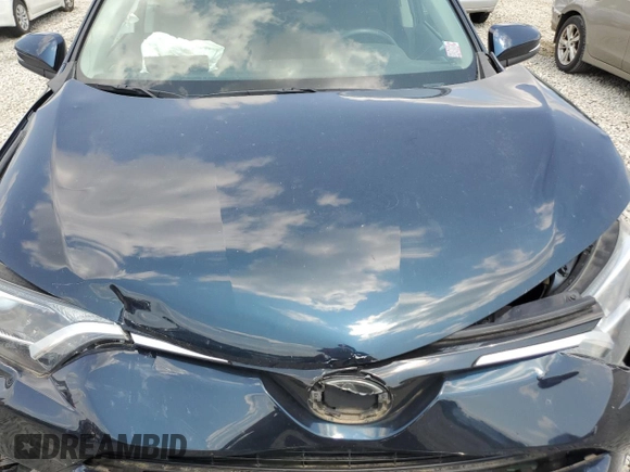 2018 Toyota RAV4 XLE with VIN 2T3WFREVXJW483012, listed as a Copart auction lot 58806205 with 48,266 mi miles and Salvage title. Bid and sale history available at DreamBid. Image 12.