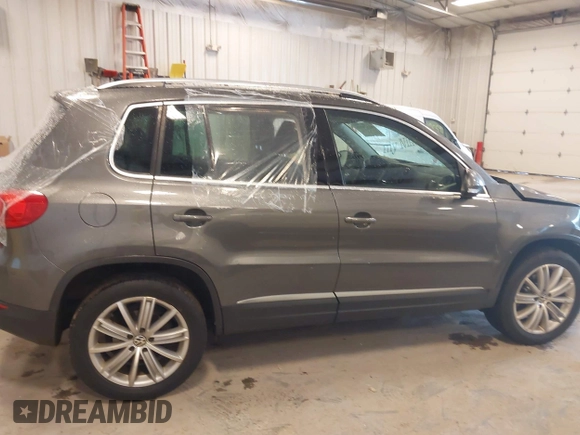 2012 Volkswagen Tiguan SE with VIN WVGBV7AX6CW093750, listed as a IAAI auction lot 42329775 with 117,509 mi miles and . Bid and sale history available at DreamBid. Image 13.