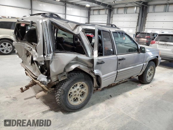 1997 Jeep Grand Cherokee Limited with VIN 1J4GZ78Y4VC589688, listed as a Copart auction lot 84673974 with 183,930 mi miles and Salvage Title. Bid and sale history available at carsss.com. Image 3.