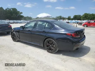 2023 BMW 5 Series 530i with VIN WBA53BH04PWY02486, listed as a Copart auction lot 54519385 with 26,979 mi miles and Salvage title. Bid and sale history available at DreamBid. Image 2.