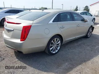 2013 Cadillac XTS Premium z VIN 2G61S5S35D9143656, wystawiony jako IAAI lot #42099511 z przebiegiem 207 055 mil mil oraz . Historia ofert i sprzedaży dostępna na DreamBid. Obrazek 4.