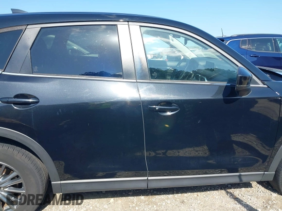 2017 Mazda CX-5 Touring z VIN JM3KFBCL0H0209458, wystawiony jako IAAI lot #42169599 z przebiegiem 93 287 mil mil oraz . Historia ofert i sprzedaży dostępna na DreamBid. Obrazek 13.