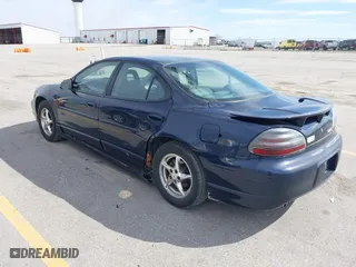 2003 Pontiac Grand Prix GT with VIN 1G2WP52K53F148801, listed as a IAAI auction lot 41888412 with 135,142 mi miles. Bid and sale history available at carsss.com. Image 3.