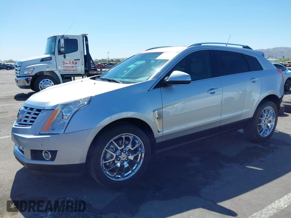 2013 Cadillac SRX Premium Collection z VIN 3GYFNEE36DS556446, wystawiony jako IAAI lot #42289824 z przebiegiem 23 988 mil mil oraz . Historia ofert i sprzedaży dostępna na DreamBid. Obrazek 2.
