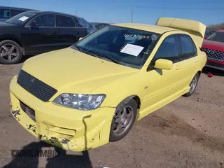 2002 Mitsubishi Lancer OZ-Rally with VIN JA3AJ86E32U081427, listed as a IAAI auction lot 41875587 with 190,214 mi miles. Bid and sale history available at carsss.com. Image 2.