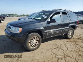 2004 Jeep Grand Cherokee Limited with VIN 1J8GW58N04C328283, listed as a Copart auction lot 62159095 with 147,593 mi miles and Salvage title. Bid and sale history available at DreamBid. Image 1.