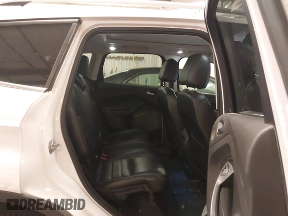 2014 Ford Escape Titanium with VIN 1FMCU9J9XEUE26857, listed as a IAAI auction lot 41552186 with 142,045 mi miles. Bid and sale history available at carsss.com. Image 8.