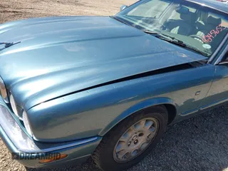 1998 Jaguar XJ with VIN SAJHX1241WC819418, listed as a IAAI auction lot 42456539 with 126,457 mi miles and . Bid and sale history available at DreamBid. Image 6.