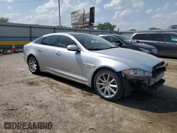 2015 Jaguar XJ with VIN SAJWJ1CD1F8V75232, listed as a Copart auction lot 57605685 with 146,314 mi miles and Salvage title. Bid and sale history available at DreamBid. Image 4.