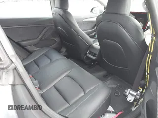 2023 Tesla Model 3 with VIN 5YJ3E1EA2PF623217, listed as a IAAI auction lot 41701413 with 21,246 mi miles and . Bid and sale history available at DreamBid. Image 8.